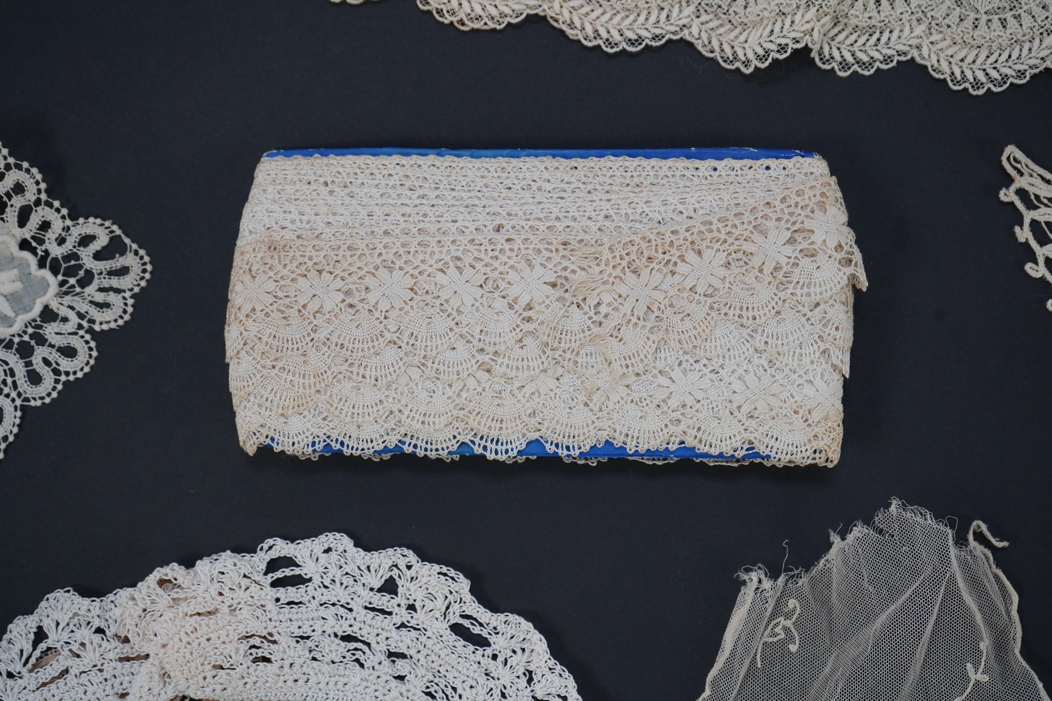 A variety of 19th and 20th century cream lace, being mixed hand and machine collars, lappets, trimmings together with a silk stole. Ideal for tv, film and theatre, stole 230 cm long. Condition - good